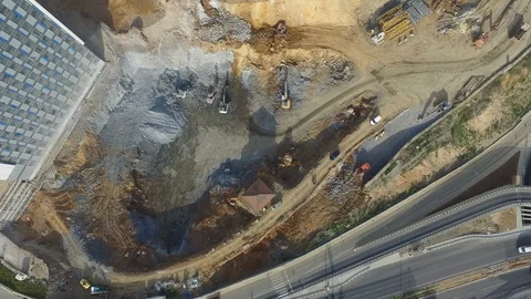 Drone view of an urban construction site with machinery equipment Stock Footage 129065295