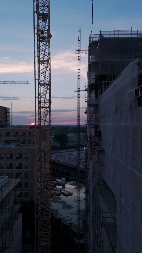 Drone view of urban construction site during sunset 動画素材 345255484