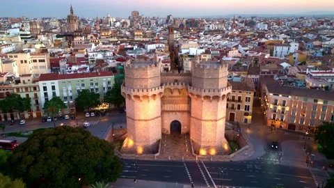 Drone view of Valencia Torres de Serranos with evening illumination, sunset Stock Footage 280698106