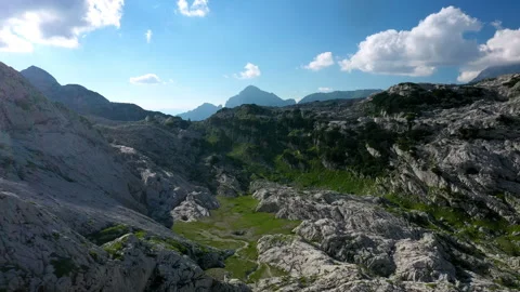 Drone view of a valley in the alps mountains on a sunny day Stock-Footage 263498809