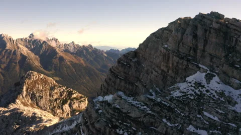 Drone view of a valley in the alps mountains covered by snow on sunset 스톡 동영상 263498920