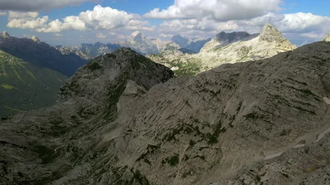 Drone view of a valley in the alps mountains on a sunny day Video stock 263500002