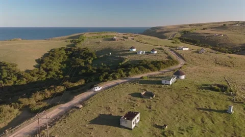 Drone View of Vehicle Driving Through Rural Village, Wild Coast South Africa Stock Footage 337051698