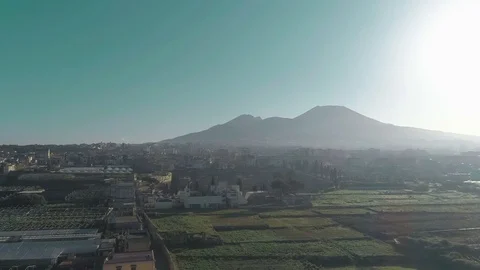 Drone view - Vesuvius to herculaneum tracking forward - backlight Stock Footage 103631131