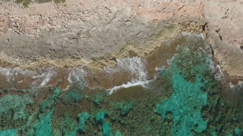 Drone view video waves breaking on the rocks in Mallorca, Balearic Isalands Stock Footage 233377597