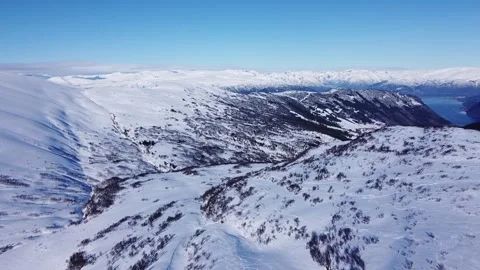 Drone View of Vik i Sogn, Norway from a snow covered Vikafjell. Stock Footage 234513252