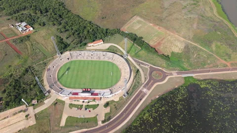 Drone view of Villa Alegre Stadium by Parana river in Encarnación, Paraguay Video stock 306363363