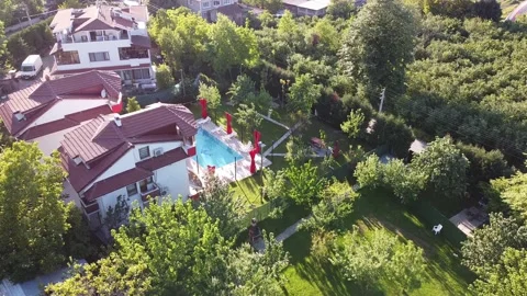 Drone view of villa with pool in the forest Stock Footage 229966314