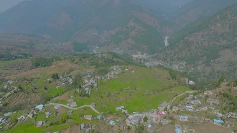Drone view of a village in Uttarakhand, surrounded by farming fields. Stock Footage 306071812