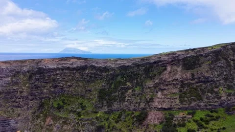 Drone View Of Volcanic Cliffs Coastal Farmland And Corvo Island In The Azores Stock Footage 337698291