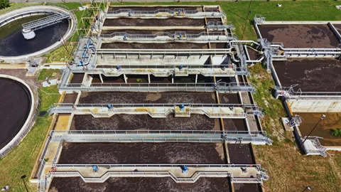 Drone view of water purification plant with tanks and equipment. Field engineer Stock Footage 337892998