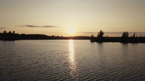 Drone view water surface river. Reflection evening sun in water river at sunset Stock Footage 80898924