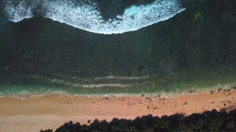 Drone view on waves and rock side at the beach Stock Footage 115900518