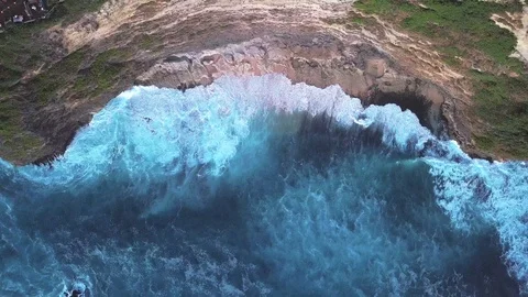 Drone view on waves and rock side at the beach Stock Footage 115901063