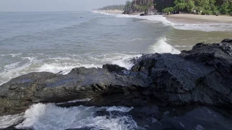 Drone view of waves crashing against rugged rocky shoreline creating dramat.. Stock Footage 340967000