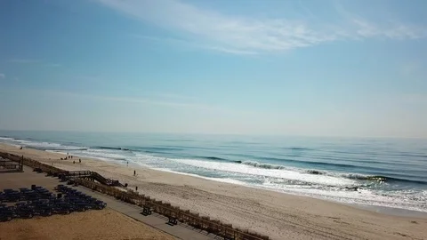 Drone view of waves crashing and seagull flying LI Beach Stock Footage 106043434