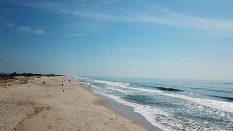 Drone view of waves crashing at beach Stock Footage 106044358