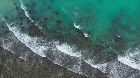 Drone view of waves crashing forming patterns in nature La Digue Seychelles Stock Footage 152256769