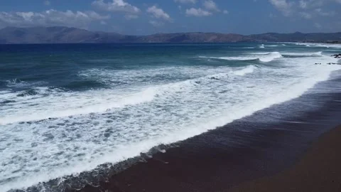 Drone View of Waves Rolling onto Sandy Beach on Crete Stock Footage 341826858