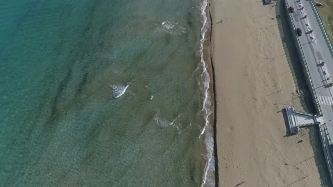 Drone view while sicilian sea waves breaking on sandy coastline, Noto, Sicily Stock Footage 179970001