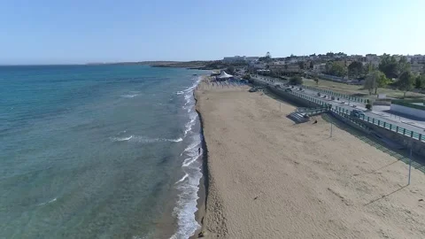 Drone view while sicilian sea waves breaking on sandy coastline, Noto, Sicily Stock Footage 179970365