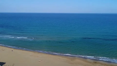 Drone view while sicilian sea waves breaking on sandy coastline, Noto, Sicily Stock Footage 179970960
