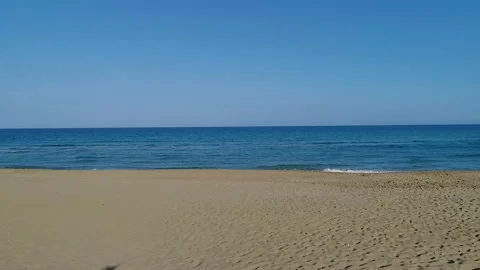 Drone view while sicilian sea waves breaking on sandy coastline, Noto, Sicily Stock Footage 179971192
