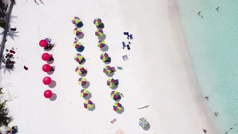 A drone view of white sand and beach umbrellas from a great height Video stock 239002972
