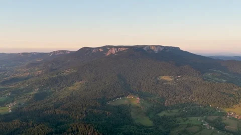 Drone view of wide mountain slopes of Romanija with scattered rural settlemen Video stock 315973099
