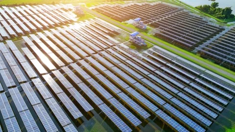 Drone view of wide solar panels glowing in sunlight. Stock Footage 321262021