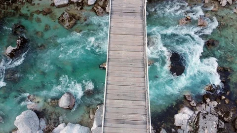 Drone view of wild river and footbridge Stock Footage 129041342