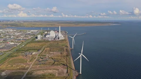 Drone view: wind farm by the Danish coast, turbines aligned at sea. Stock Footage 318793947