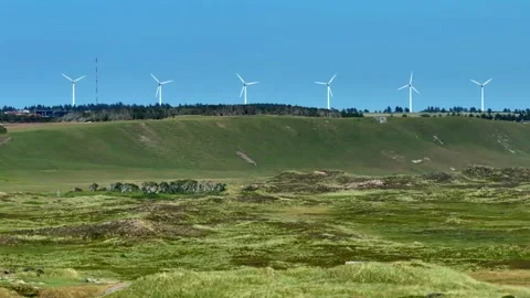Drone view of a wind farm at sunset. Multiple wind turbines, Wind turbines on be Stock Footage 260419887