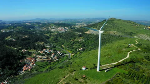 Drone view to the wind power turbine generating clean renewable energy.  Scen Stock Footage 219945283