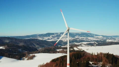 Drone view of wind turbine operating in snowy winter field Stock Footage 343100144