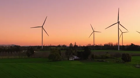 Drone view of wind turbines farm in sunset. Renewable energy production. Stock Footage 272186028