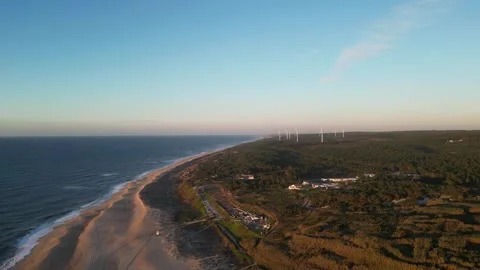Drone view of wind turbines in a forest by the Atlantic Ocean, Portugal. Stock Footage 329132664