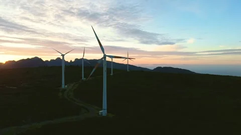 Drone view of Wind turbines in the mountains with amazing sunrise, foggy clouds Stock Footage 278716838