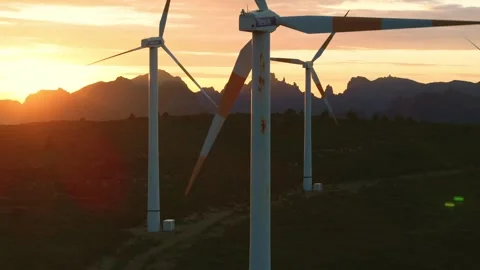 Drone view of Wind turbines in the mountains with amazing sunrise, foggy clouds Stock Footage 278717358