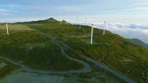 Drone view of Wind turbines in the mountains with amazing sunrise, foggy clouds Video stock 278718469
