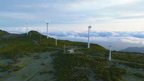 Drone view of Wind turbines in the mountains with amazing sunrise, foggy clouds Stock Footage 278720298