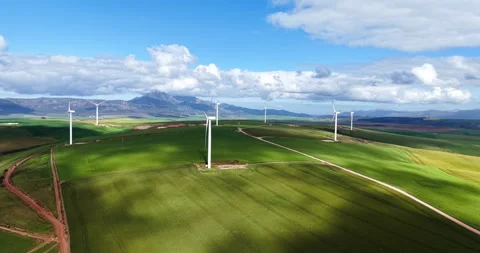 Drone View of Wind Turbines Over Yellow Canola Fields, Overberg, Western Cape Stock Footage 345081777