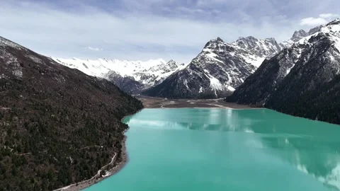 Drone view of winding road through western China mountain valley Stock Footage 337894293