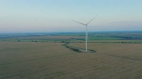 Drone view of a windmill in agricultural fields generating renewable energy. Stock Footage 220766155