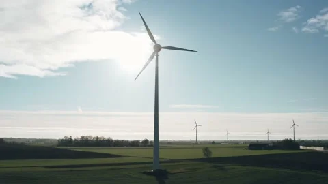 Drone view windmills wind turbines in green fields on sunny autumn day Stock Footage 165702632