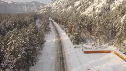 Drone view of winter road among forest Vídeos de archivo 223837573