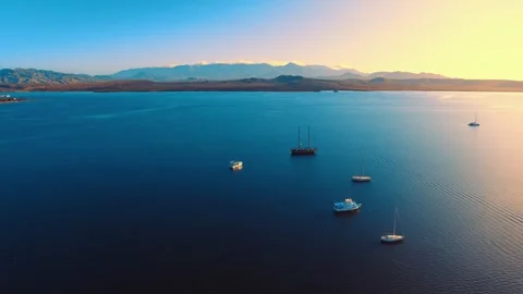 Drone view of yachts sailing in the open Caribbean Sea during a summer sunset. Stock Footage 313866456