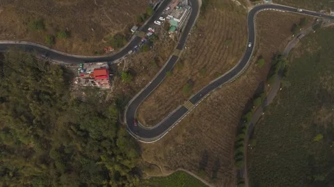 Drone view zigzag road in Mirik, North Bengal, India, at 4,905 feet. Stock Footage 341963926
