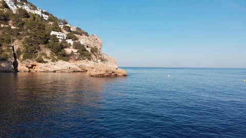 Drone views of a beach cove with rocks Stock Footage 128984665