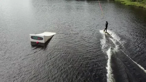 Drone Wakeboarder Start from the pier behind the winch 60 fps Stock Footage 134336506